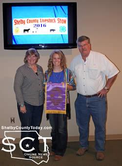 Megan Dunn, Center 4-H, is seen with Hawkeye Hunting Club representatives during the 2016 Shelby County Livestock Auction on Saturday, March 5, 2016. Dunn had the Grand Champion Steer of the show and Hawkeye Hunting Club had the high bid on the steer. (Additional livestock show and sale photos to be posted soon.)
