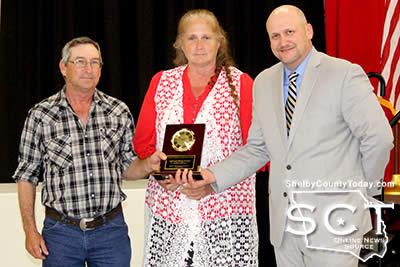 Jeff Parker (left) and his wife Betty Parker (middle) were the recipients of the 2016 Farm Family of the Year Award. Presenting them with their award is Ed Johnson (right).