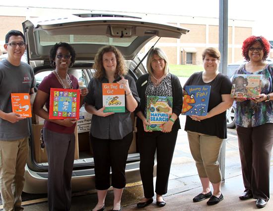 Stephen F. Austin State University’s Jacks Council on Family Relations and Residence Hall Association recently donated approximately 1,000 books to the Greater East Texas Community Action Program Head Start and Early Head Start.   Pictured, from left, are Adrian Gutierrez, SFA child development and family living senior and Jacks Council on Family Relations president; Vanessa Thorn, SFA child development and family living senior and JCFR member; Dr. Jennifer Newquist, SFA assistant professor of child development and family living, who supervised the book drive; Dian Wise, GETCAP Head Start education coordinator; Shannon White, ISD education coordinator for GETCAP Head Start; and Shanté Teal, ISD education coordinator for GETCAP Early Head Start.