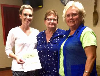 From left: Anna Lee presents donation to Brown and Judy Stegall of Empty Arms