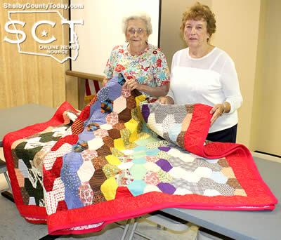 Bobbie Nutt (left) sold Odessa Link (right) the winning ticket for the quilt.