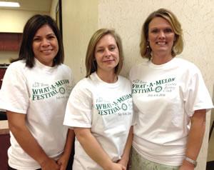 Shelby Savings Bank employees modeling the 2016 What-A-Melon Festival T-Shirts
