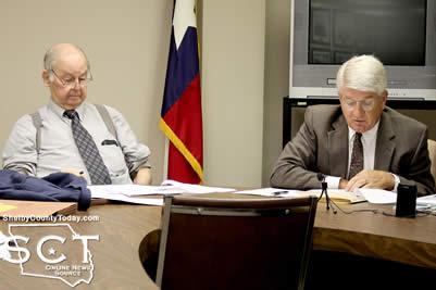 Judge Charles "Brick" Dickerson (left) listens as Judge Charles Mitchell speaks with Chief Bradley Wilburn about the probation department budget.