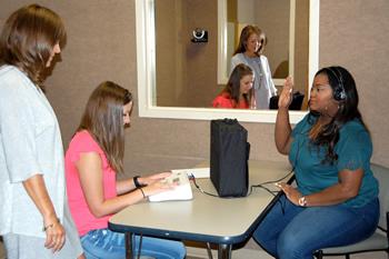 Stephen F. Austin State University graduate students practice administering hearing screenings on each other in the Gwen and Ed Cole Audiology Lab on the university campus. Recently, the Cole Audiology Lab was awarded the 2016 Best of Nacogdoches Award by The Daily Sentinel.