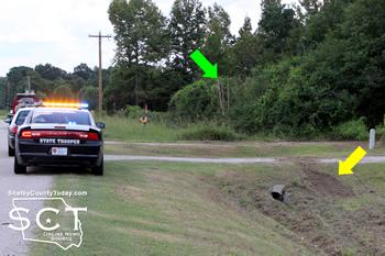 Yellow arrow indicates where the car stuck the culvert and the green arrow indicates where the car entered the wooded area.