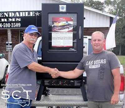 Brad Johnson (right) was the winner of the Master Built Propane Smoker offered during the Shelbyville Lion's Club fundraiser. He is seen with Glenn Johnson (left), Shelbyville Lion's Club President.