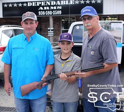 Shad Lout (left) won the Marlin 30-30 offered through the Shelbyville Lion's Club fundraiser. He is pictured with Colby Lout (middle) and Glenn Johnson, Shelbyville Lion's Club President.