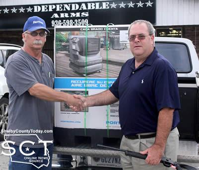 Kevin Jones (right) was the winner of the Rossi-Braztech Youth 410 and the Portacool 3000 during the Happenings at Shelbyville Hill Festival. Presenting Jones with his winnings was Glenn Johnson, Shelbyville Lion's Club President.