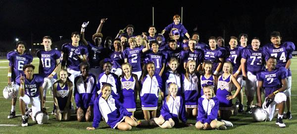 CMS eighth grade purple football team and cheerleaders after the last home game of their middle school career.​ Click image to enlarge.