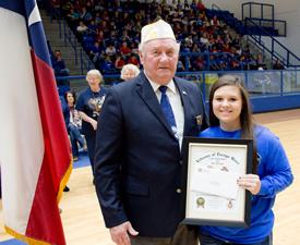 Post Commander Gene Hutto presenting Darby her co first place award at the Joaquin Veterans Day program, November 11, 2016