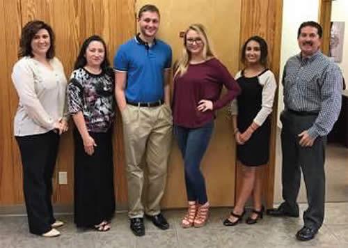 Steve Waters (right) poses alongside CHS UIL seniors, Lexi Parker and Kimberly Rodriguez, and Sabine State Bank Staff members. Photo: Chris Watlington