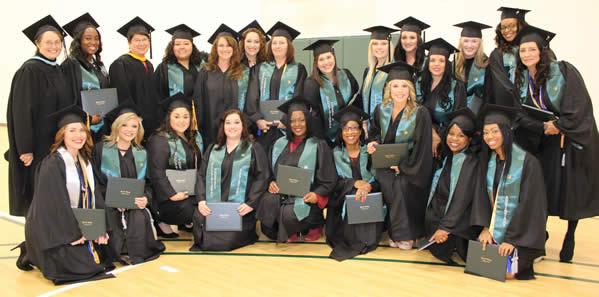 Instructors, Cheri Lambert and Terri King, pose with their Occupational Therapy program’s graduating class of fall 2016.