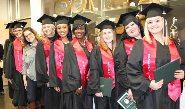 Medical Lab program graduates pause to take a photo with their instructor, Jo Ellen Russell.