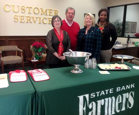 Employees welcome visiters at Farmers State Bank open house held December 19th.