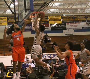 TJ Killings scores the layup in the second half against Angelina.