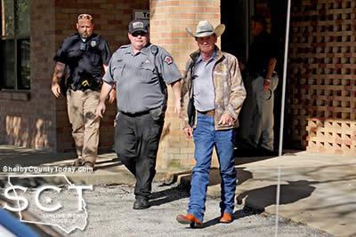 Shelby County Sheriff Willis Blackwell is seen exiting the Administration meeting room with Deputy Jim Ed Matthews and Tenaha Deputy City Marshal Darren Gray.