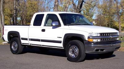 Not actual pickup but similar. Pickup is extended cab and does have chrome strip along the sides. Paint is peeling on hood.
