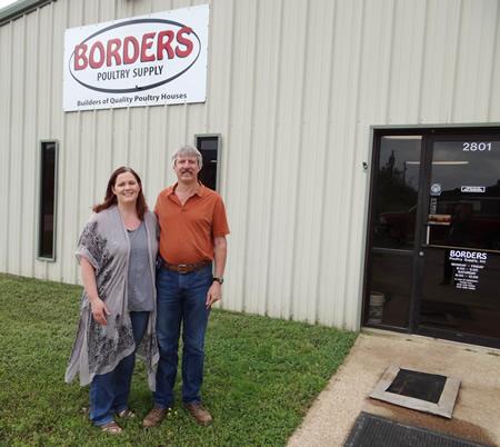Kim Borders Payne and Rob Payne standing at the entrance of Borders Poultry Supply on Westward Dr. in Nacogdoches. (Photo by C. Wayne Mitchell, president and CEO of Nacogdoches County Chamber of Commerce)