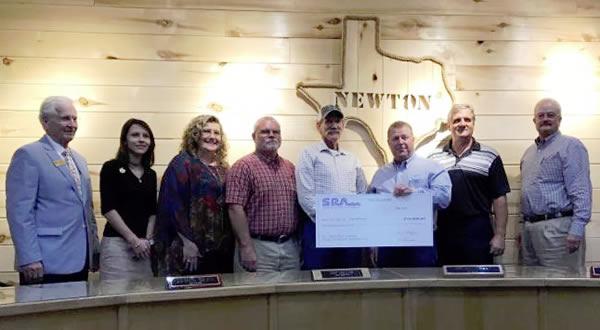 L to R: Jerry Springfield with Representative James White's Office, Rachel Iglesias and Lanie Brown with U.S. Congressmen Brian Babin's Office, Newton County Commissioner Gary "Tick" Fomby, Newton Mayor Mark Bean, SRA Board member David Koonce, Newton City Administrator Donnie Meek, and SRA Lower Basin Regional Manager Bill Hughes