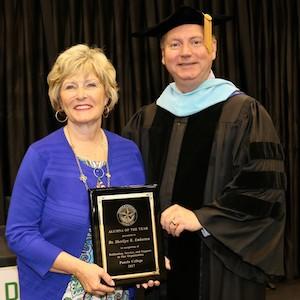 Dr. Greg Powell stands with Panola College Alumna of the Year, Dr. Sherilyn Emberton.