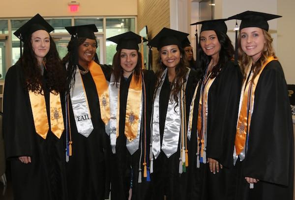 Students in the National Society of Leadership and Success pose for a photo before their commencement ceremony. 