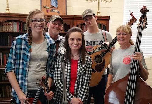 Silver Dew Bluegrass Band players are Hannah Menefee, Tim Blake, Anna Bardwell, John Williams, and Nancy Blake.