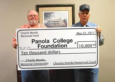 Photo: (from left) Nat Lankford and Harley Wilson with a check for the Charlie Woods Memorial Scholarship to the Panola College Foundation. 