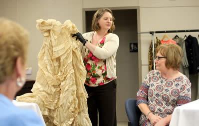 Textile conservator Melanie Sanford of Textile Preservation Services of Texas showcases a skirt from 1875 during Conserving the Classics: A Lecture with Melanie Sanford held at Stephen F. Austin State University. The skirt is part of SFA’s collection of approximately 800 pieces of fashion items. The university is working to raise funds to update facilities to help preserve these artifacts.