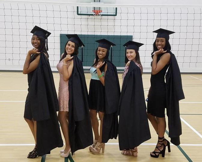 Panola Volleyball sophomores Victoria Baptista, Ana Oliveira, Cyrani Butler, Morgan Currie & Rachel Henderson pose before the 2017 Spring Commencement Ceremony in May