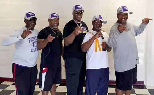 Dwight Preston (left) is seen with his fellow championship football teammates from Kansas Wesleyan University who attended the mentoring program and camp and helped out.