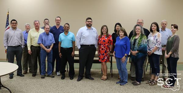 Rotary members and Shelby County Children's Advocacy Center staff stand together to raise funds.