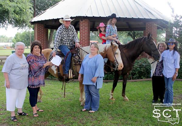 The Pony Express began their journey Tuesday in Timpson where they met with representatives of the city. Pictured are (from left): Marilyn Corder, Timpson Area Chamber of Commerce Representative; Leslie Leathers, City Secretary; Danny Dixon on Jalapeño "Pepper" the horse; Paula Mullins, Municipal Court Clerk; Sarah Dixon and Delayna Higginbotham on "Floyd" the horse; Donna Higginbotham, Austin State Bank; and Rose Dixon.
