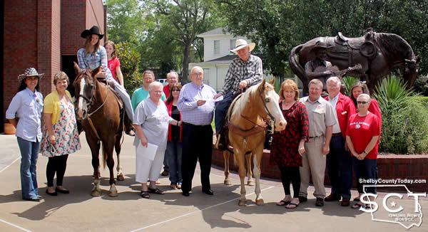 Carthaginians gathered and welcomed the Timpson Frontier Days Pony Express. Pictured are (from left): Rose Dixon, Denise Meek, Sarah Dixon and Delayna Higginbotham on "Floyd" the horse, Becky Barlish, Marilyn Corder, Bill Smith, Debbie Allums, Mayor Lynn Vincent, Danny Dixon on Jalapeño "Pepper" the horse, Tommie Ritter Smith, Tommy Brown, John Ray, Renee Nolan and Dena Wilson.