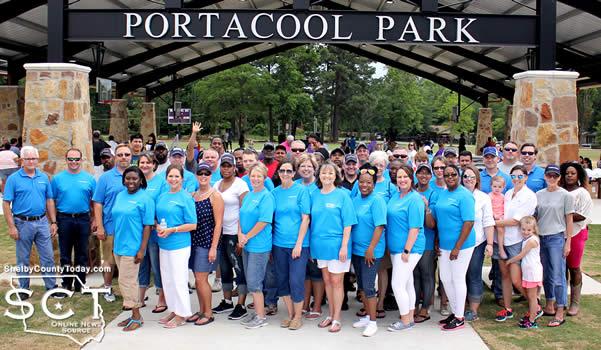 Portacool employees and representatives gathered before the Portacool Park entrance.