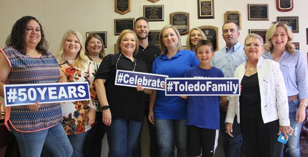 From left: Alicia Plata, Branch Asst Manager; Katie Johnson, Administrative Assistant; Jennifer Davis, Administrative Assistant; Leslie Jordan, District Supervisor; Kirk Dillon, Vice President of Operations; Casie Windham, Branch Manager; Lisa Barbee, Administrative Vice President; Jameson Schoelpple, grandson of Peggy and the late Pat Buddin; Brad Davis, President; Peggy Buddin; Ashley Alexandria, granddaughter of Peggy and the late Pat Buddin