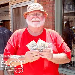 Bill Hudman was all smiles when he was the winner of the $500 drawing at the car show.
