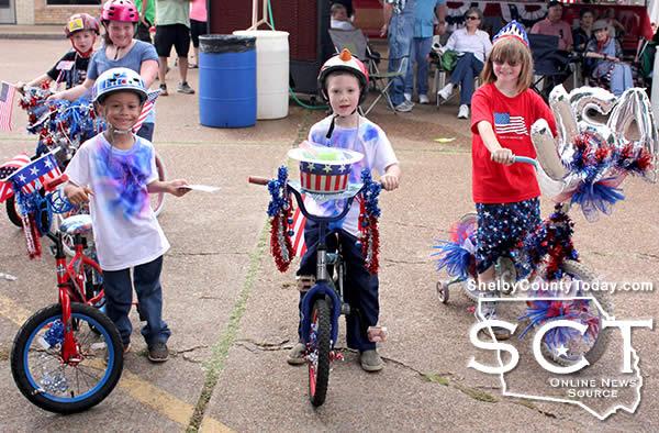 Several children showing their patriotic spirit decorated their bikes and participated in the bicycle decorating competiion. PIctured are (from left): Isaiah Hall, Jedediah Lowe, and Caitlyn Madden.
