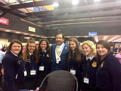Pictured are (from left): Jaylee Sims, MaKayla Mayo, Maddie Russell, Texas FFA Foundation board member Victor Guerra, Madison McMillian, Gracie Clifton, Carsen Vickers.