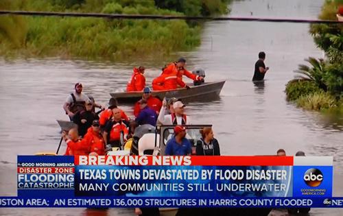 This television image shows jon boats bringing  flood victims to safety in the wake of Hurricane Harvey. (Photo by Matt Williams)