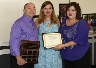 Natalie Clem of Memphis, Tennessee, is the first recipient of the Christopher J. Snyder Memorial Scholarship. Kim Luna, right, and Michael Munro, left, director of the visual impairment and orientation and mobility program at Stephen F. Austin State University, presented the award to Clem during a scholarship reception last week. Snyder, a two-time graduate of SFA’s orientation and mobility program, was an assistive technology teacher and orientation and mobility specialist for Nacogdoches ISD, working with special-needs students throughout the district.