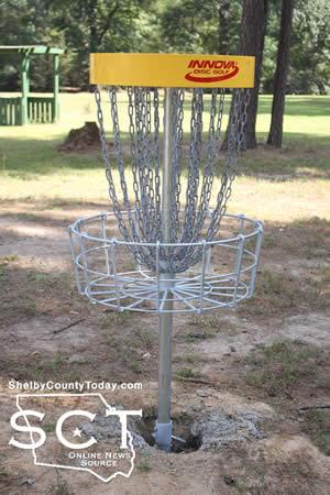 Each hole has a basket (pictured above) which players aim for with their discs.