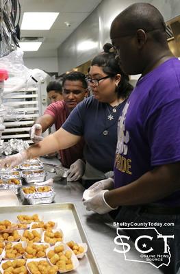Students prepare meals for the Food Recovery program with leftover food which would have been thrown away.