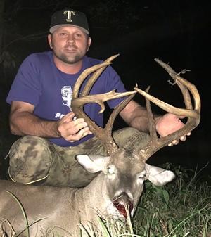 Angelina County hunter Bradley Henson with his impressive 11 pointer taken by rifle on MLD property on Oct. 15. Henson's open range non-typical grosses 169 1/8 and nets 165 6/8 B&C. (Courtesy Photo)