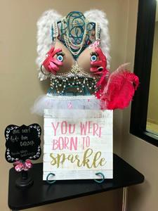 The “eyes” have it! The Panola College Cosmetology Department’s “You Can’t Hide from Breast Cancer” entry won first prize in the ‘Fit for the Cure’ decorating contest.