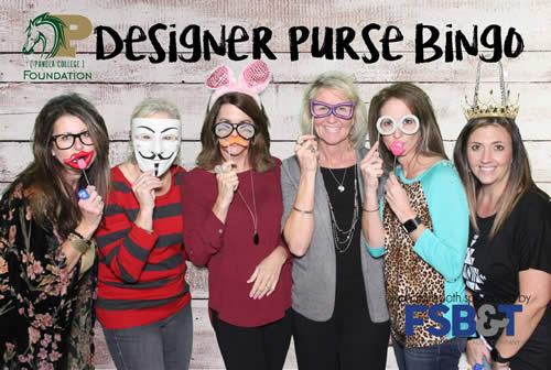 First State Bank & Trust Company employees take advantage of the photo booth that evening.  