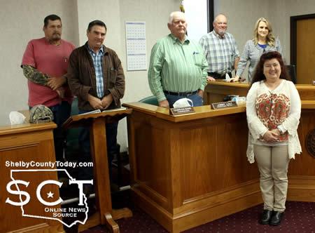 Martha Ventura (front) is a Panola College student of governmental studies. As part of her class she was to attend a local government meeting and following the Commissioners' Court the officials posed with her for a photo.