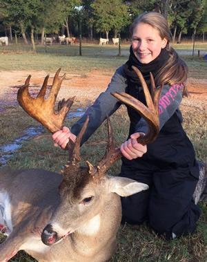 Lady hunter Chloe Howard of Bullard displays the 21-point bruiser she brought down while hunting with her uncle, Clint Miller, of Jacksonville. She was hunting on 100 acres of open range in Nacogdoches County. (Photo courtesy of Clint Miller)