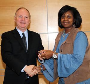 Dr. Greg Powell congratulates Dazell Hicks for 35 years of service. (Not pictured: Dr. Bob Wilkins.)