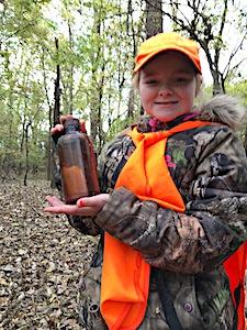In early November, 10-year-old Ashley Rogers of Huntsville, Ark., was deer hunting with her father, Brandon, along the Arkansas River near Ft. Smith when she discovered this old bottle. The bottle contained a hand-written note from the late Victor Floyd Elliott, dated April 25, 1944. Elliott, who grew up in Fairfax, Okla., is now deceased and buried in Temple, Tx. He was 14 when he tossed the bottle into the Arkansas River, presumably near Fairfax, roughly 300 miles upstream from where Rogers found it nearly 74 years later. It ranks among the oldest message-in-a-bottle finds ever documented in the United States. (Photo courtesy of Brandon Rogers)