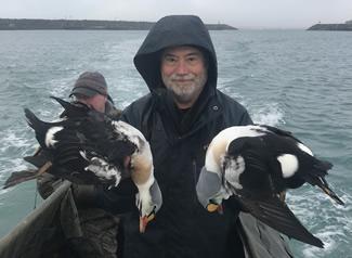 Tim Boatman with a pair of colorful King Eiders. The big water ducks are extremely tough to kill and capable diving beyond 150 feet deep. (Courtesy Photo)